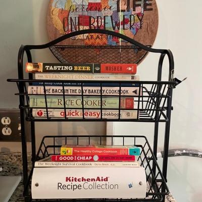 Cookbooks With Metal Shelf Stand And Brewery Sign