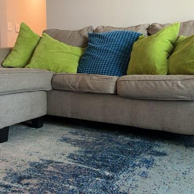 Upholstered Sofa With Chaise And Throw Pillows