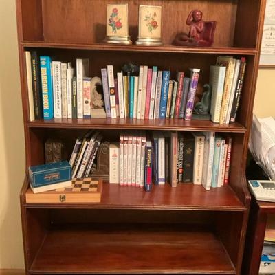 Tall Wood Bookshelf with Books and Decor