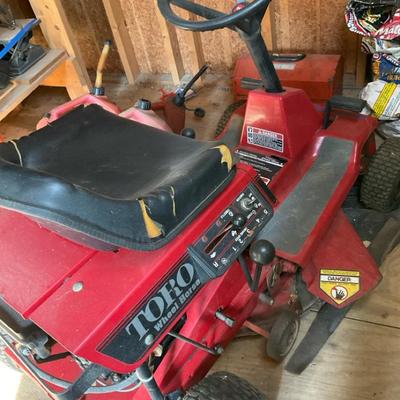 Toro Riding Lawnmower And Gas Containers 