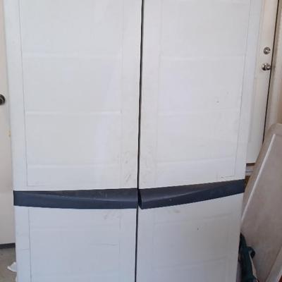 Garage Cabinet With Household Sprays, Automotive Cleaners, and Maintenance Supplies