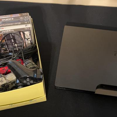 PlayStation 3 Console with Controllers and Games