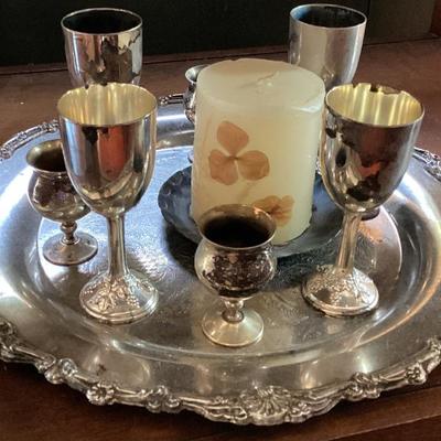 Silver tray with 6 goblets and a candle holder