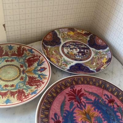 Three Decorative Ceramic Plates with Varied Floral and Geometric Patterns