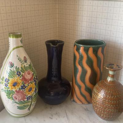 Four Decorative Ceramic Vases with Varied Designs