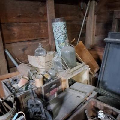 Old poolstick rack. Bottles.