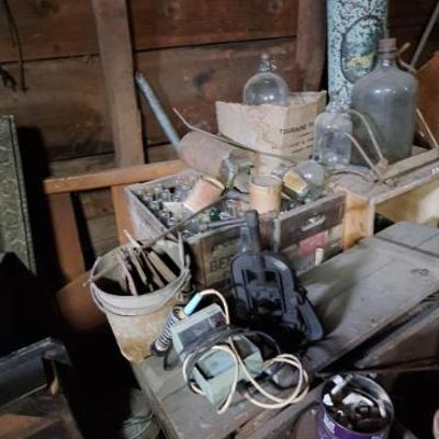 Bottles, pipe vise, soldering iron