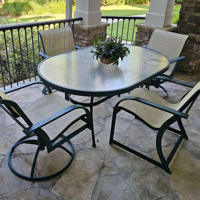 Oval Glass Top Patio Table with Four Chairs