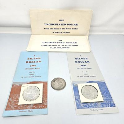 Lot #193 - Uncirculated 1884 & 1885 U.S. Silver Dollar Coins w/ Mint Paperwork, Plus a Circulated 1882 Silver Dollar