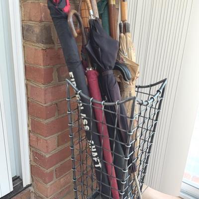 Umbrellas, walking sticks and umbrella stand