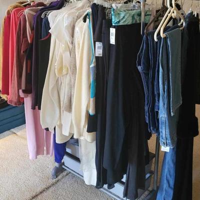Racks of clothing still new with tags