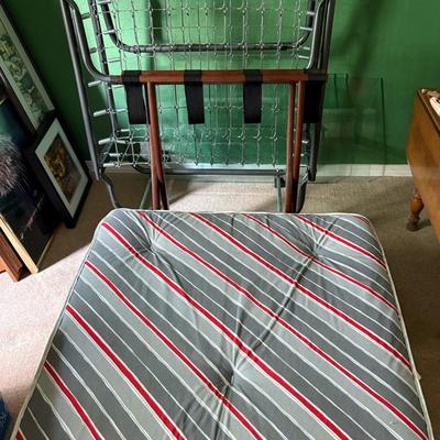 Twin Spring And Mattress And A Folding Luggage Rack