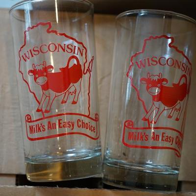 There is a box of twelve of the vintage Dairy glasses never used.