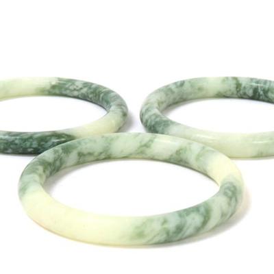Sale Photo Thumbnail #126: Lot 125 group of three chinese marbled green bangles