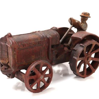 Sale Photo Thumbnail #487: Lot 487 cast iron mechanical tractor toy with driver
