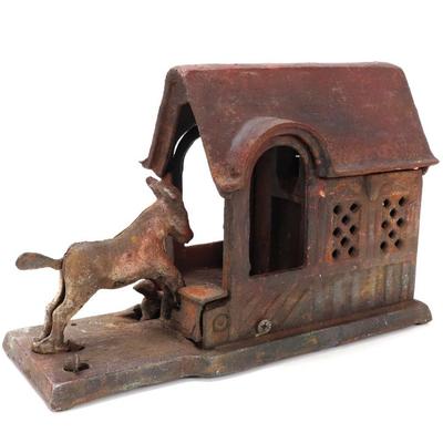 Sale Photo Thumbnail #173: Lot 172 vintage cast iron mechanical donkey in a barn coin bank