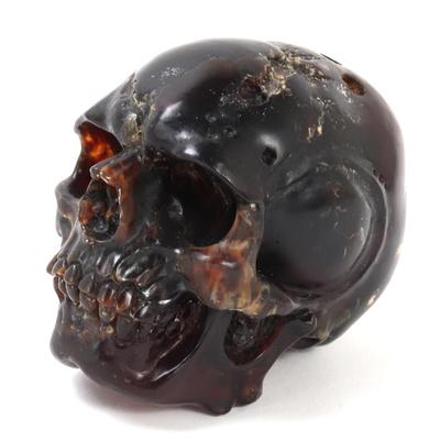 Sale Photo Thumbnail #181: Lot 180 finely crafted fossilized amber skull