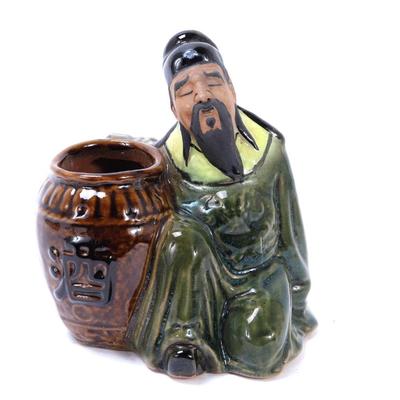 Sale Photo Thumbnail #347: Lot 346 chinese porcelain man w import vessel statue