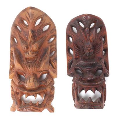 Sale Photo Thumbnail #437: Lot 437 lot of two vintage hand carved filipino dragon masks