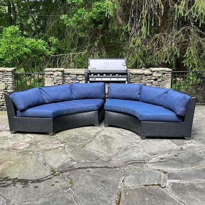 (2pc) Pair Curved Outdoor Settees | Woven black all-weather material with navy blue outdoor cushions Dimensions: h. 30 x l. 90 x d. 35 in...