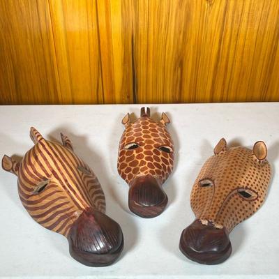 (3pc) Carved Wood Animal Masks From Kenya | Zebra, Giraffe and Leopard carved decorative wall art. Dimensions: h. 17 x w. 6 x d. 4 in...