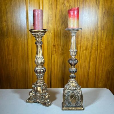 (2pc) Gilt Composite Candlesticks | A near pair, gilt carved style candlestick holders - h. 24.75 x w. 6.5 x d. 4.25 in (tallest)
