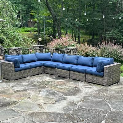 Outdoor Modular Sectional Sofa | Having an aluminum frame wrapped in all-weather wicker, with navy blue outdoor cushions, 7 modular...