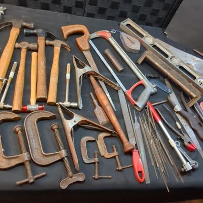 Large Lot Tools:Variety of hand saws, C Clamps, pipe wrenches files and tools for working with 
