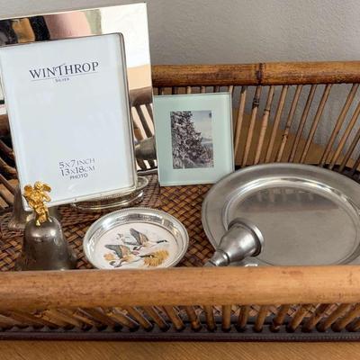 Rectangular Wicker Basket, Silver Picture Frame, and Assorted Decor