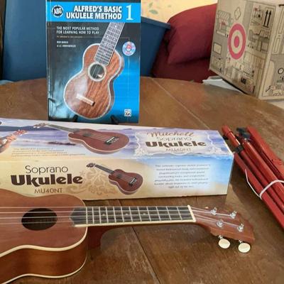 2 Mitchell MU40NT Soprano Ukuleles (One In Box), Music Stand And Book 