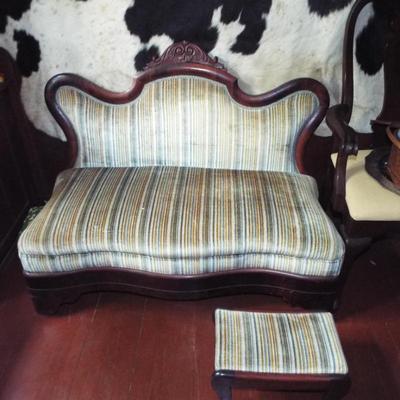 Sale Photo Thumbnail #214: ANTIQUE EMPIRE STYLE STRIE VELVET MAHOGANY FRAME ARMLESS SETTEE WITH SMALL FOOT STOOL
AND FULL BLACK AND WHITE HOLSTEIN COW HIDE RAW EDGE