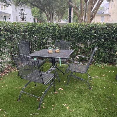 Wrought iron rocker chairs and  table
