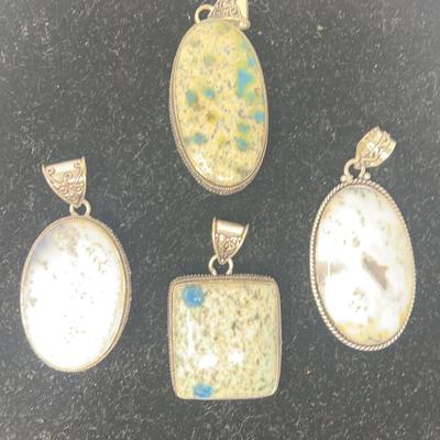 Dendrite Opal Or White Buffalo Pendants