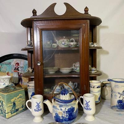 Collection Of vintage Dutch Themed Porcelain Mini Tea Sets In Curio Cabinet