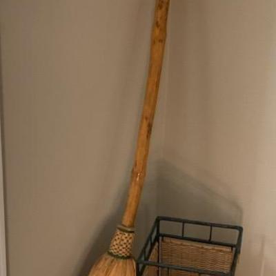 Decorative Broom, Wicker Umbrella Stand, and Red Umbrella