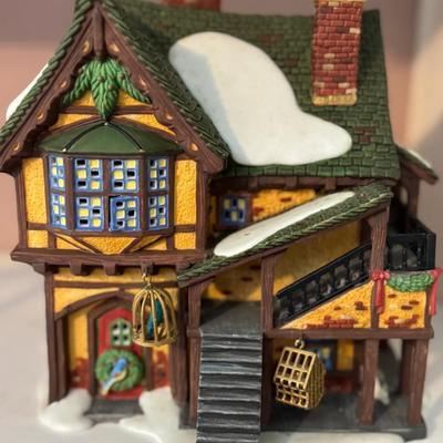 Lot 105:  Department 56 “Wingham Lane Parrot Seller”