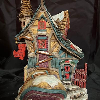 Lot 324: Storybook Village – “The Old Woman Cobbler” Lighted House and Figures – Set of 5 (One Broke