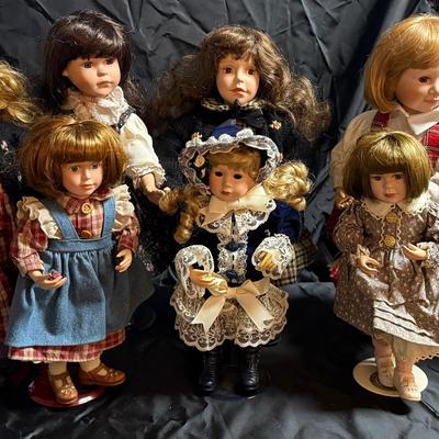 Lot 400: Lot of 9 Vintage Porcelain Dolls – Various Styles & Outfits – Collectible Display Set