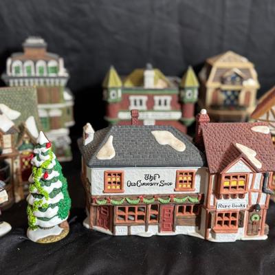 Lot 133:  Dept 56… 8 Pieces Dicken’s Village Series