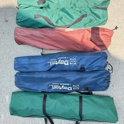 Five Collapsible Chairs And A Small Canopy