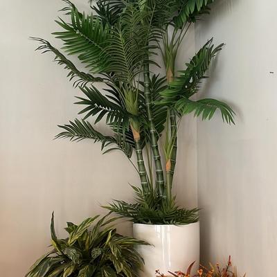 Assortment Of Faux Plants In Pots