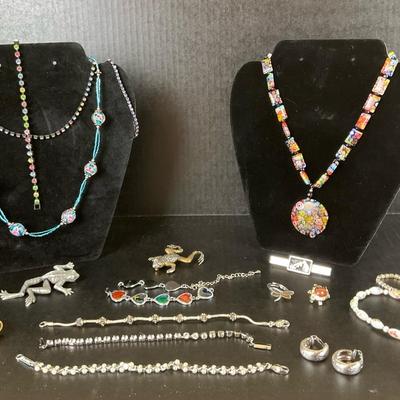 Costume Jewelry Lot with Necklaces, Bracelets, and Brooches