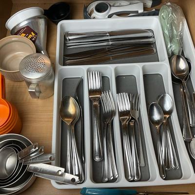 Kitchen Drawer Lot: Flatware, Measuring Cups, and Tools