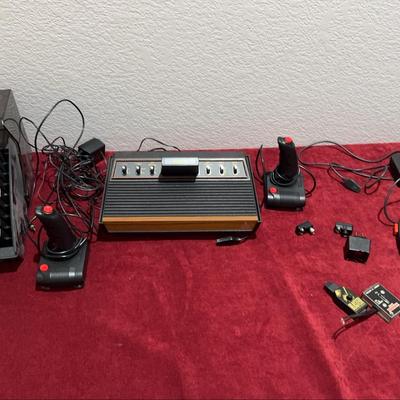 Vintage Atari Gaming System Includes Games And Controllers  Not Tested
