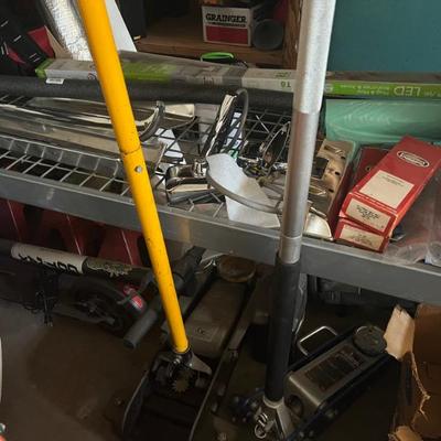 2 CAR JACKS IN FORE GROUND.