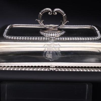 pair of silver covered casserole dishes
