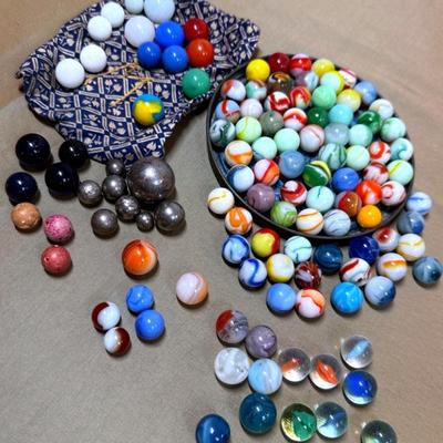 A collection of marbles peewees clay, steelies & more