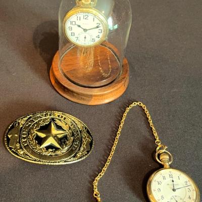 Two pocket watches & a Texas belt buckle 