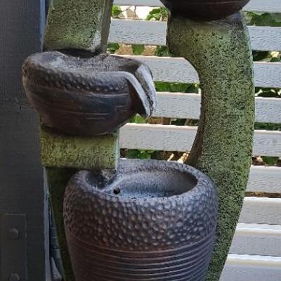 Cascading Serenity: A Tranquil Tiered Garden Fountain