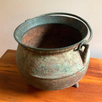 Early cast iron pot in old green paint